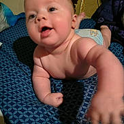 Buddy joined the competition — help win amazing prizes! arm, baby, bed, bedding_pattern, blanket, cheek, closeup, crawling, cute, diaper, face, hand, infant, pillow, playful, portrait, reaching_hand, room_interior, sleepwear, smile