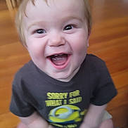 Thomas joined the competition — help win amazing prizes! toddler, child, smiling, happy, indoor, floor, clothing, shirt, face, eyes, mouth, baby, person, sitting, wooden_floor, toy, shorts, cute, expression, joy