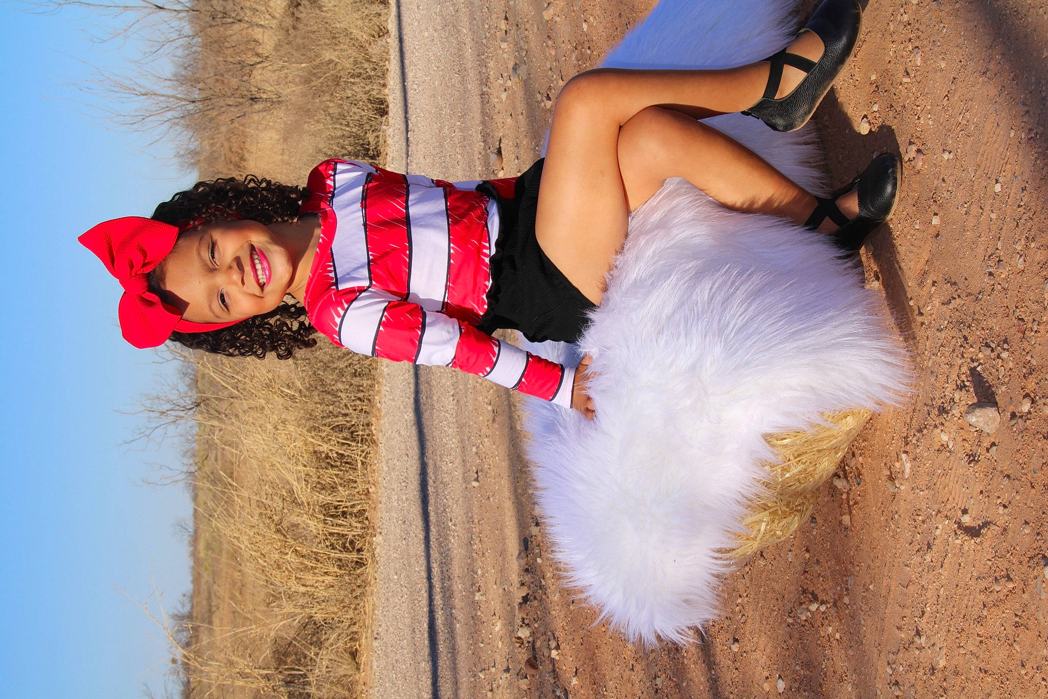 Isabel is registered to the contest to win money with this photo: arm, azure, barefoot, dress, fun, grass, happy, headwear, human_leg, joy, landscape, leisure, nature, people_in_nature, person, plant, sand, summer, sunlight, thigh