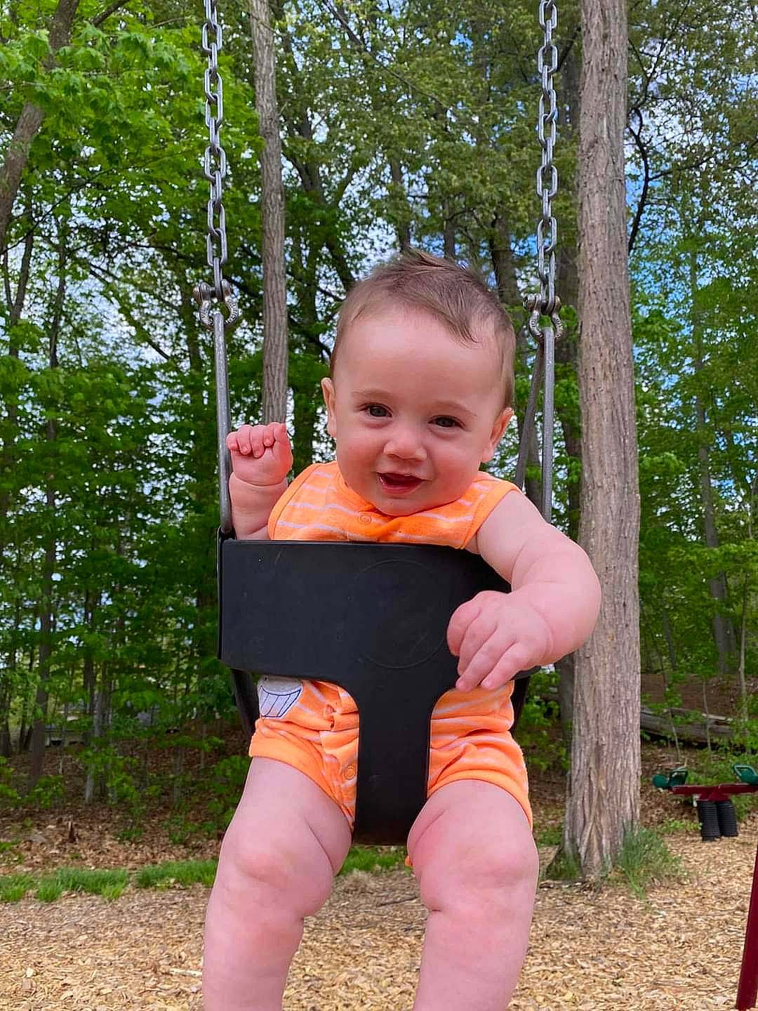 Everett joined the competition — help win amazing prizes! baby, baby_toddler_clothing, child, city, fun, grass, happy, leisure, outdoor_play_equipment, people_in_nature, person, pink, plant, playground, recreation, sitting, smile, swing, t_shirt, toddler