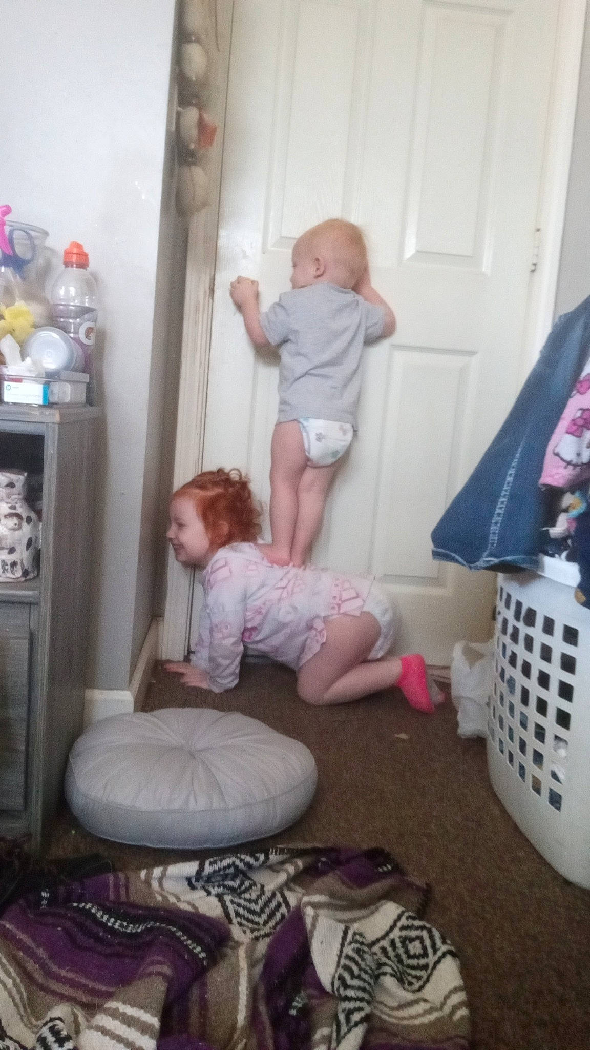 Kingston is registered to the contest to win money with this photo: baby, baby_products, baby_toddler_clothing, child, comfort, door, drawer, flag, flooring, fun, hat, joy, person, pink, room, shelf, sitting, sock, toddler