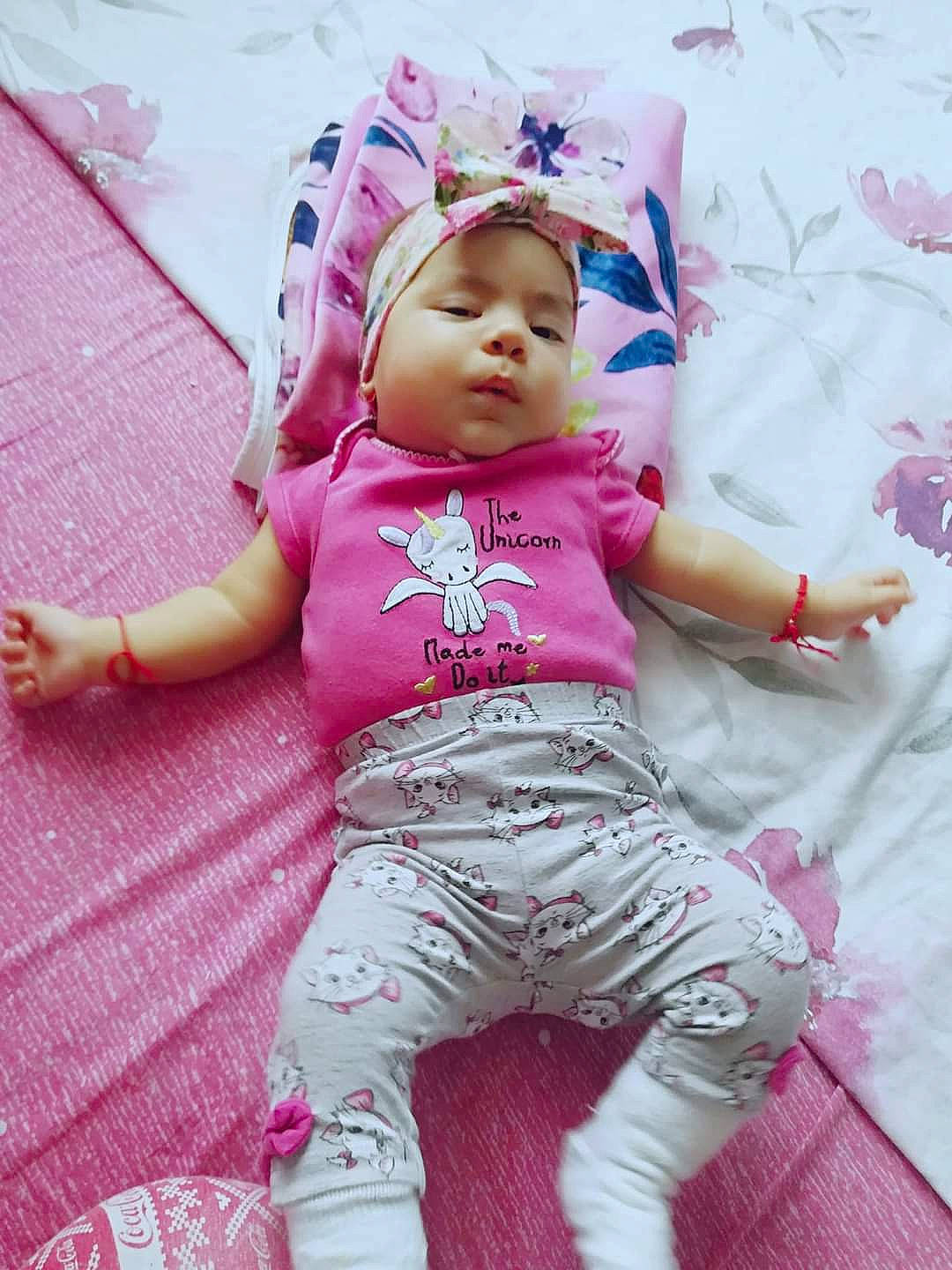 Beatrice is registered to the contest to win money with this photo: baby, cheek, child, headwear, person, pink, skin, toddler