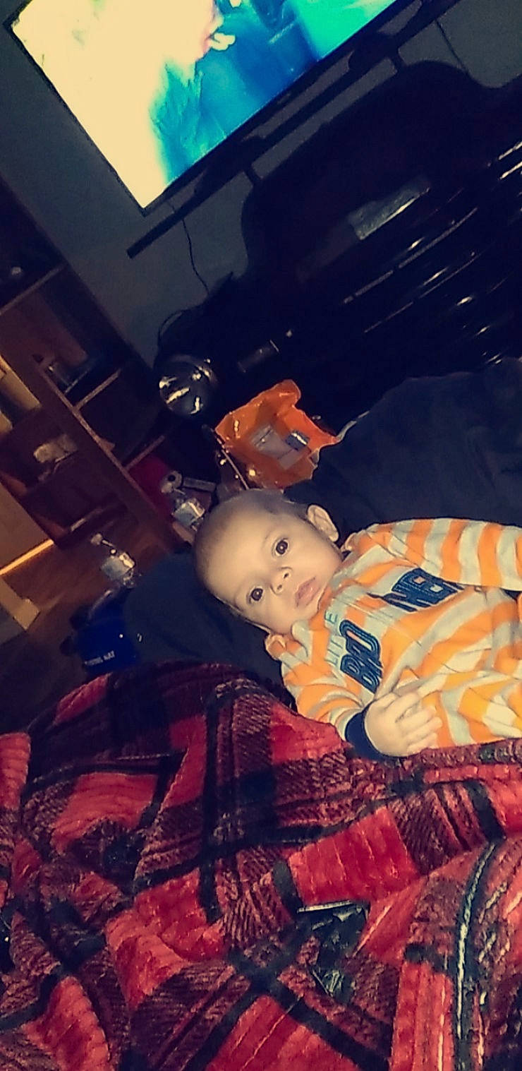 Keith is registered to the contest to win money with this photo: blue, carmine, child, cloud, doll, flesh, fun, night, pattern, person, room, sitting, sky, tints_and_shades, toy