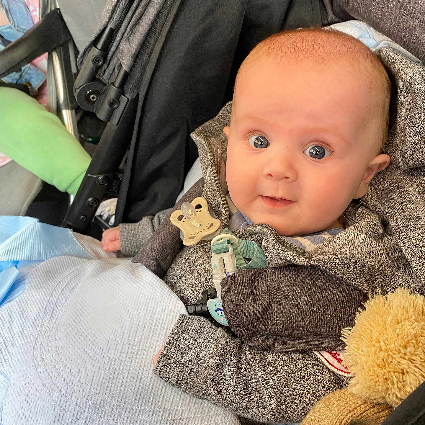 Reilly is registered to the contest to win money with this photo: baby, car, car_interior, clothing, coat, cushion, face, hat, head, homedecor, jacket, knitwear, newborn, pants, person, photography, portrait, stroller, sweater, toy