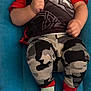 clothing, shorts, face, head, person, photography, portrait, pants, baby, footwear, shoe, hosiery, sock, toy, t_shirt, bodypart, finger, hand, jeans, sneaker