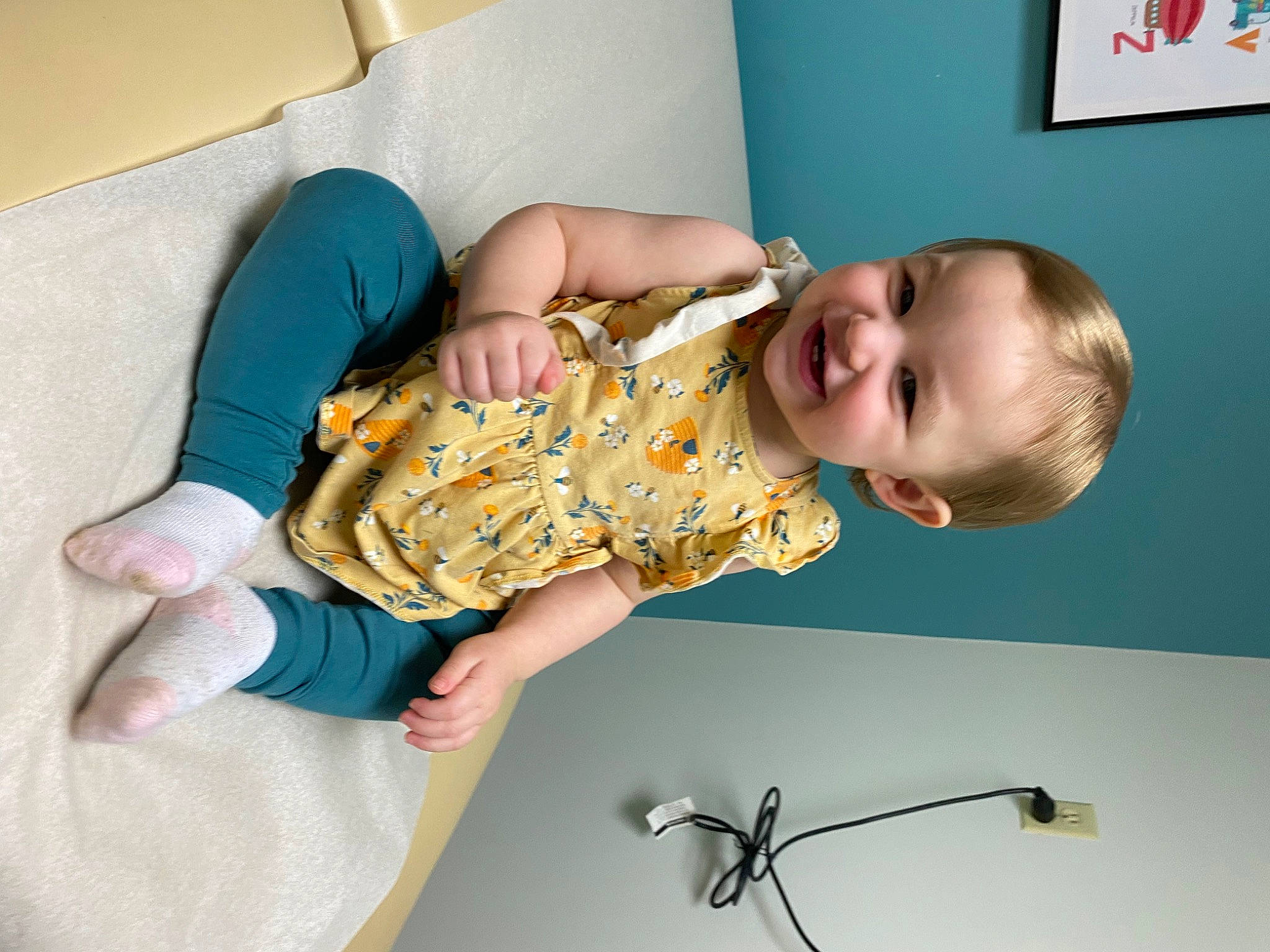 Madelynn is registered to the contest to win money with this photo: arm, baby, baby_toddler_clothing, bicycle, bicycle_handlebar, child, comfort, couch, elbow, finger, gesture, hand, human_body, joint, joy, person, picture_frame, room, skin, sleeve