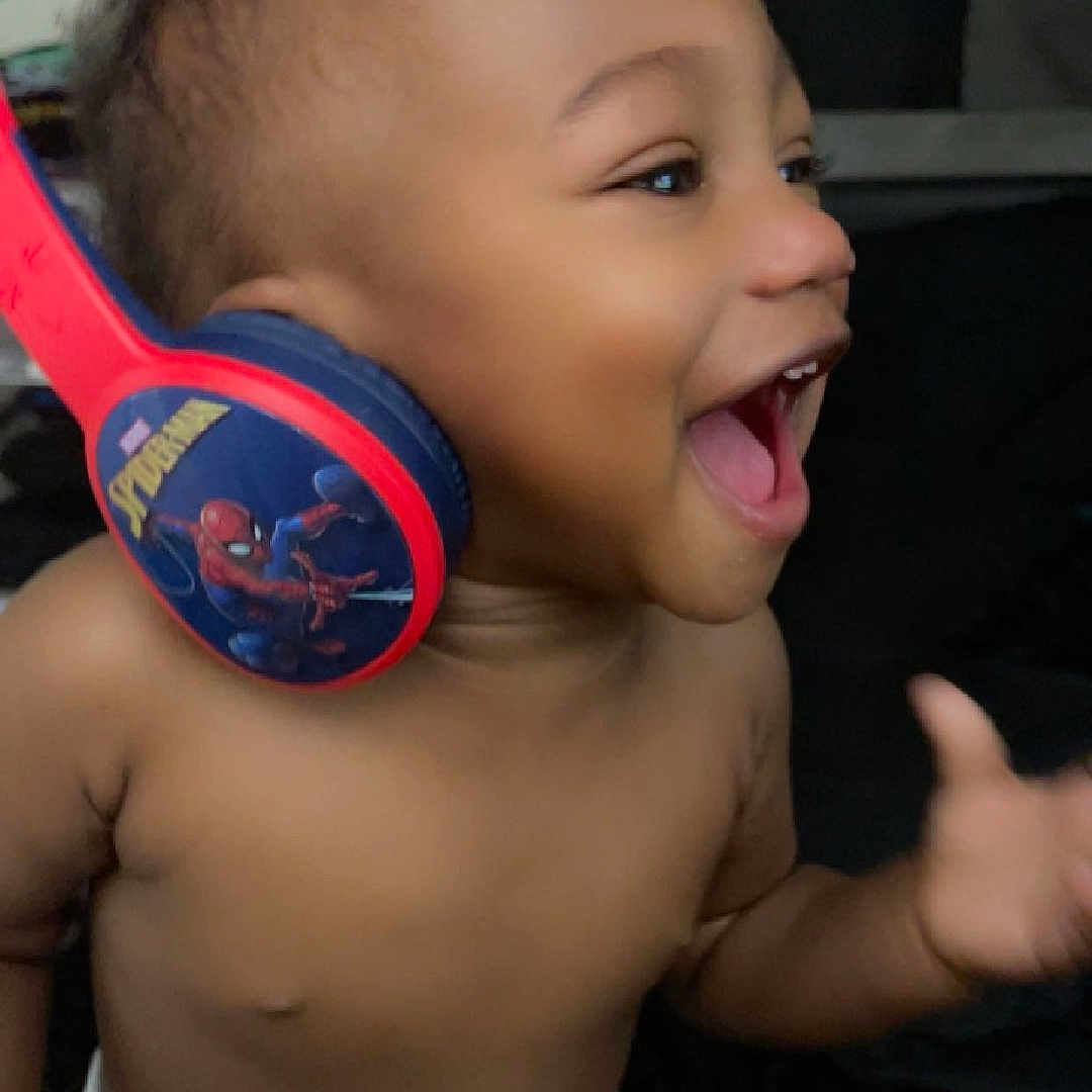 Terry Holder joined the competition — help win amazing prizes! baby, bodypart, clothing, diaper, electronics, face, finger, hand, happy, head, headphones, laughing, mouth, person, photography, plant, portrait, pottedplant, t_shirt, teeth