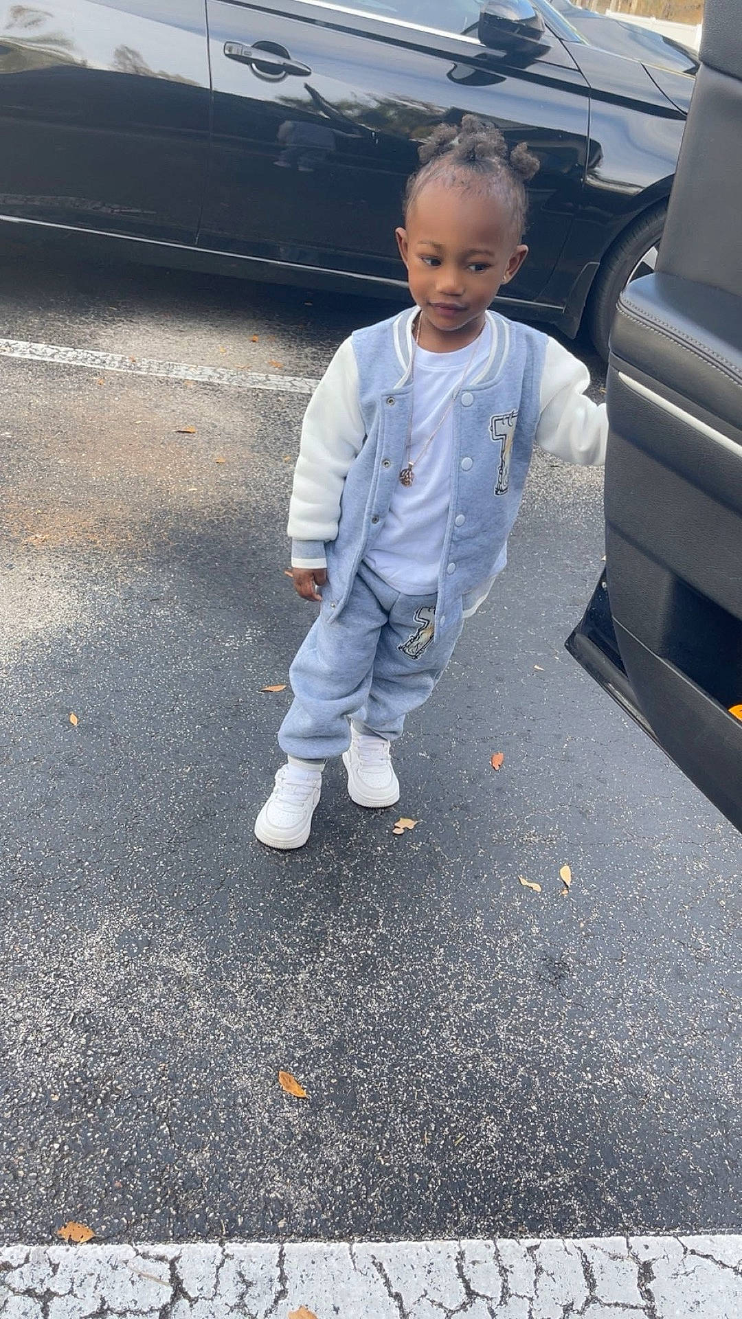 boy, child, city, clothing, coat, face, footwear, head, jacket, jeans, male, pants, person, photography, portrait, road, shoe, street, urban, walking