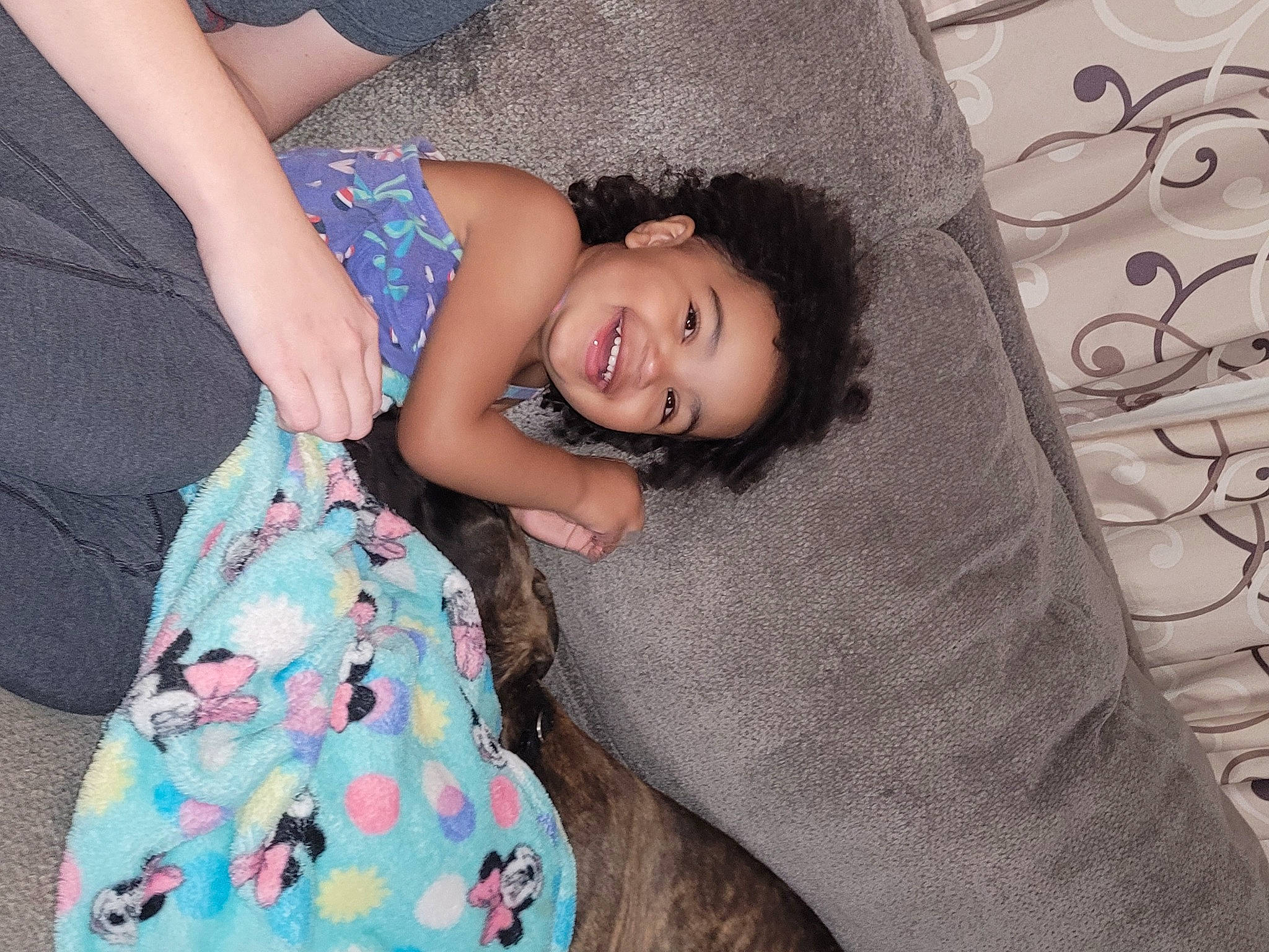 Molana is registered to the contest to win money with this photo: baby_toddler_clothing, child, comfort, couch, elbow, fun, happy, human_leg, joy, lap, laugh, leisure, linens, pattern, person, room, sitting, skin, smile, textile