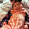 baby, smiling, sleeping, headband, bow, blanket, clothing, infant, cute, indoors, portrait, child, cozy, pink, floral, soft, happiness, peaceful, newborn, resting