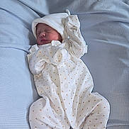 Lottie-May joined the competition — help win amazing prizes! newborn, baby, sleeping, onesie, white_clothing, triangle_pattern, blanket, blue_blanket, infant, peaceful, resting, cute, soft_texture, cozy, indoors, portrait, baby_clothes, child, human, sleep