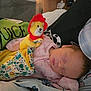 Lottie-May joined the competition — help win amazing prizes! baby, sleeping, plush_toy, blanket, pillow, beetlejuice, pink_clothing, face, child, cute, indoor, resting, cozy, soft_toy, fabric, comfort, peaceful, infant, nap, bed