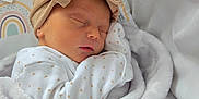 Lottie-May is registered to the contest to win money with this photo: newborn, baby, sleeping, blanket, headband, bow, bed, bedding, pattern, rainbow, soft, cute, infant, wrapped, clothing, peaceful, rest, child, indoors, closeup