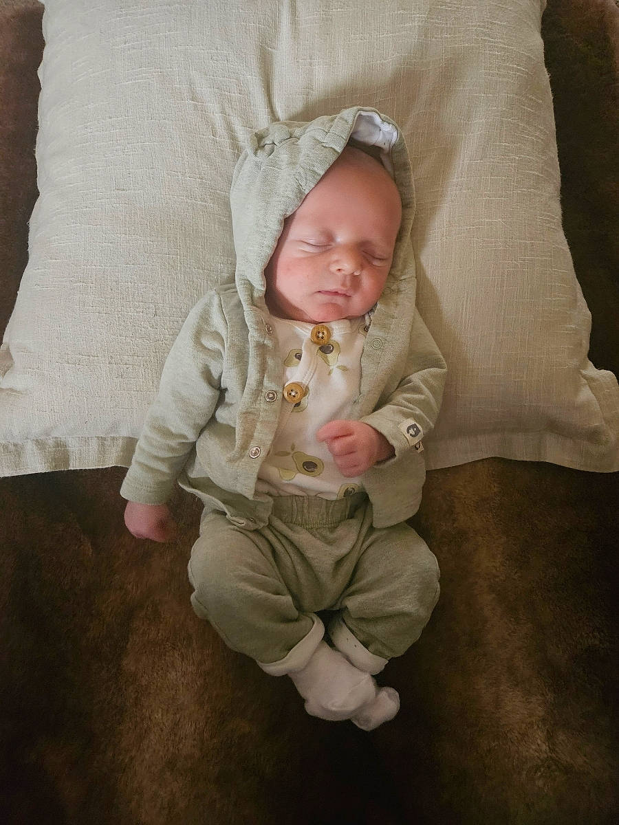 Jasper joined the competition — help win amazing prizes! baby, baby_toddler_clothing, cheek, child, comfort, eye, flooring, foot, grass, linens, person, portrait_photography, room, sitting, skin, sleeve, toddler, wood