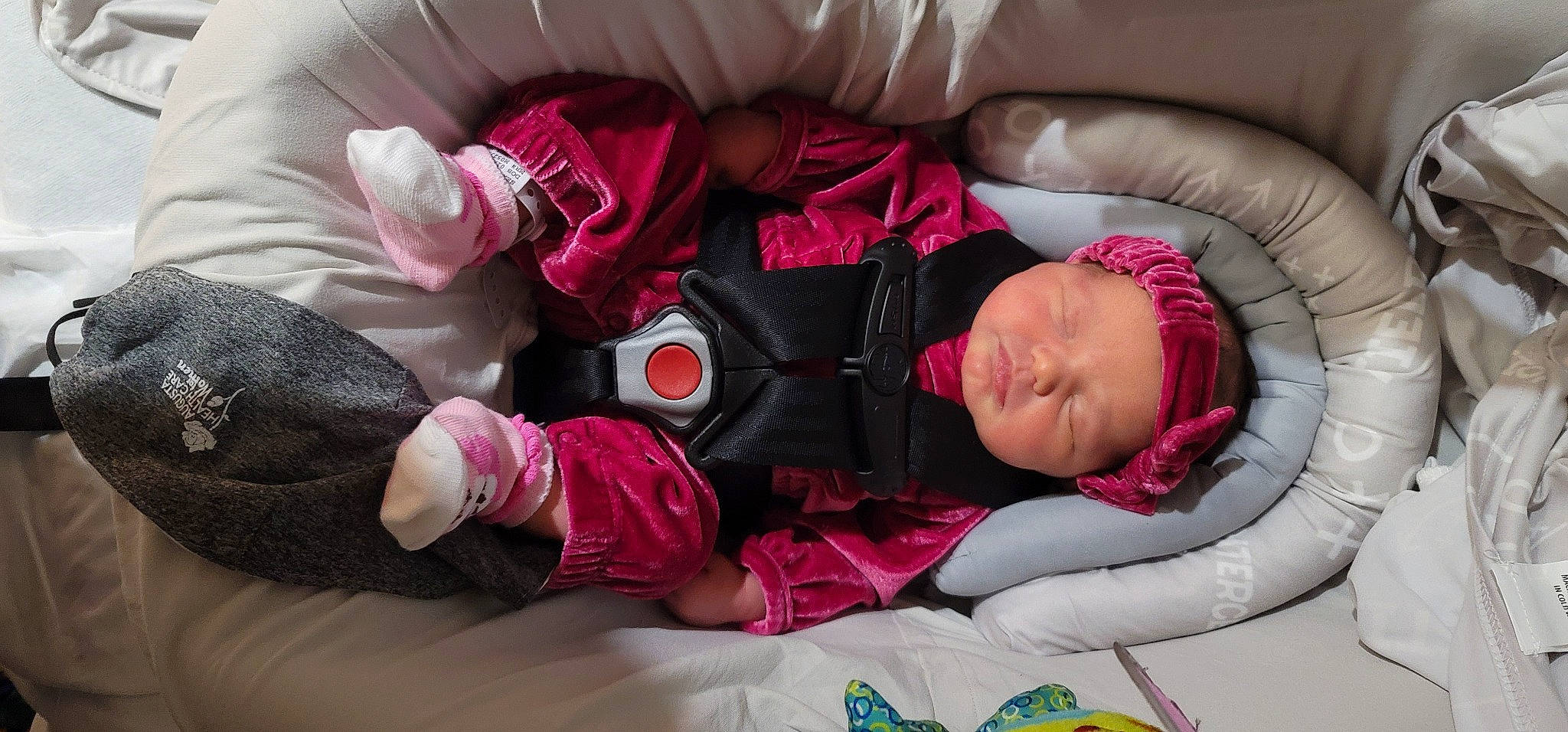 Araya is registered to the contest to win money with this photo: baby, baby_carriage, baby_products, baby_sleeping, baby_toddler_clothing, bedtime, carmine, child, comfort, finger, headwear, linens, magenta, nap, person, pink, purple, room, sitting, sleep