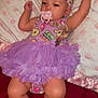 baby, tutu, headband, pacifier, blanket, polka_dots, sleepy, cute, infant, purple_clothing, soft_texture, raised_arm, lying_down, indoors, child, skin, foot, hand, face, adorable