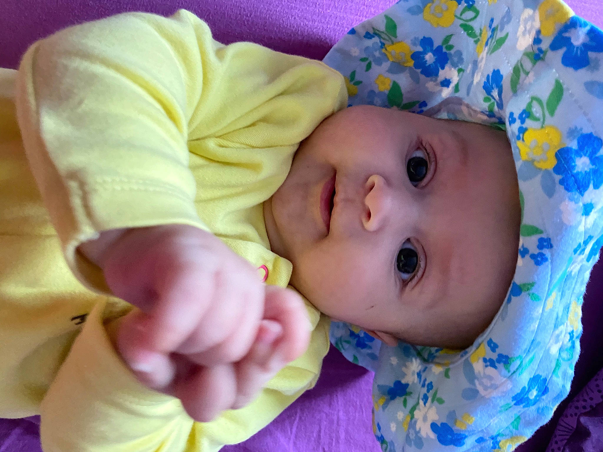 Antonia is registered to the contest to win money with this photo: baby, cheek, child, finger, hand, head, headwear, mouth, nose, person, pink, skin, smile, toddler, yellow