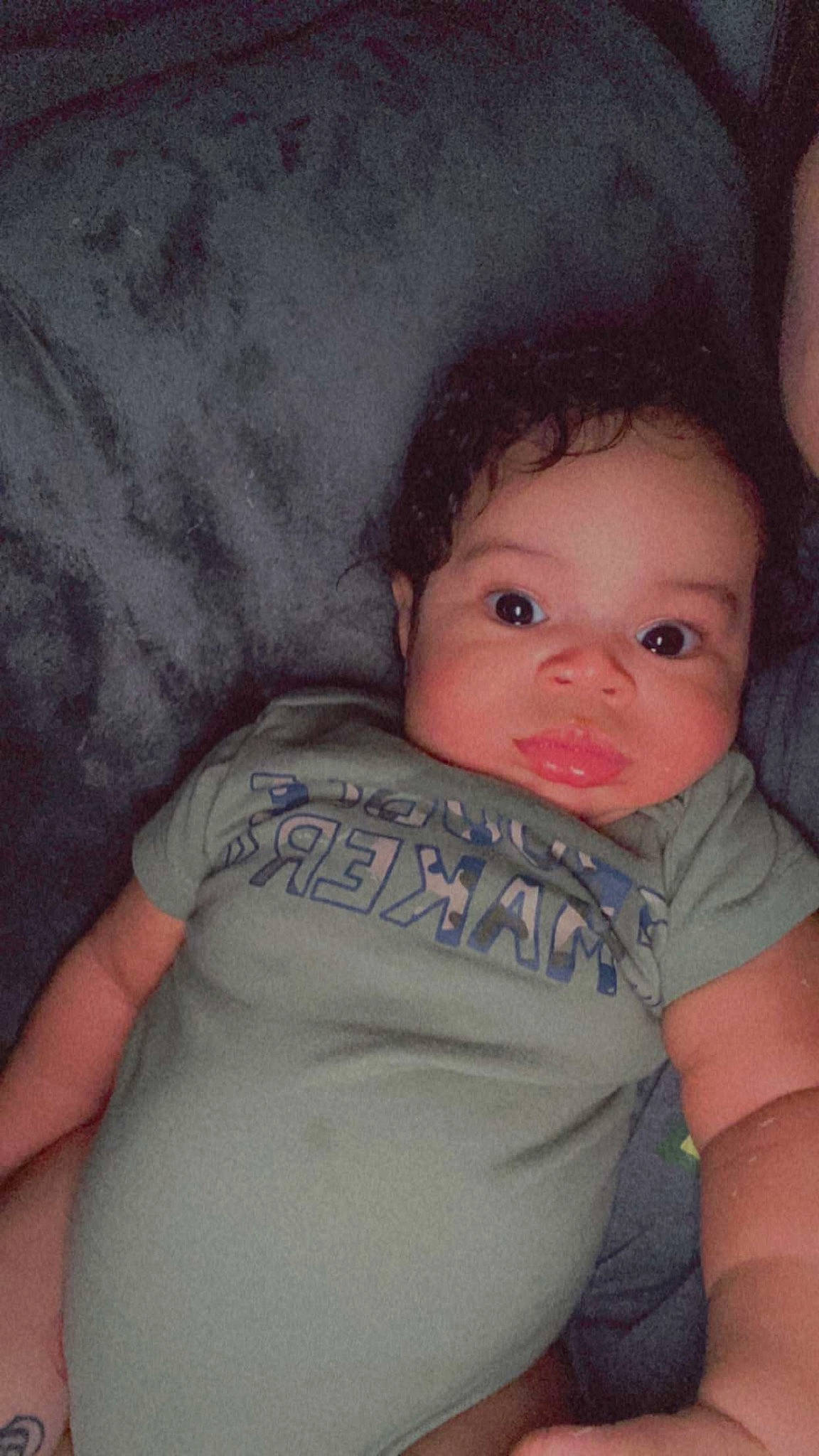 Kyrie is registered to the contest to win money with this photo: baby, baby_toddler_clothing, cheek, comfort, elbow, eye, eyebrow, flash_photography, happy, human_body, iris, lip, neck, nose, person, skin, sleeve, smile, textile, toddler