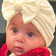 Sofia joined the competition — help win amazing prizes! baby, infant, child, portrait, close_up, face, eyes, wide_eyed, bow, headband, roses, flowers, red, cream, clothing, indoor, sitting, looking_at_camera, cute, photography