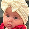baby, infant, child, portrait, close_up, face, eyes, wide_eyed, bow, headband, roses, flowers, red, cream, clothing, indoor, sitting, looking_at_camera, cute, photography