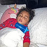 Thomas joined the competition — help win amazing prizes! bed, blanket, blue_sippy_cup, child, comfort, cozy, curly_hair, cute, headboard, indoor, nap, pajamas, peaceful, person, red_clothing, rest, sleeping, soft_texture, toy, unicorn_pillow