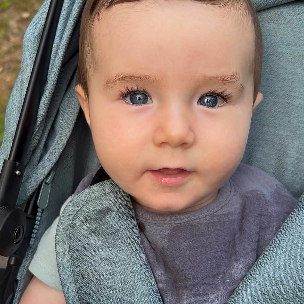 Shiloh joined the competition — help win amazing prizes! baby, child, stroller, portrait, blue_eyes, face, infant, clothing, drool, close_up, curious, soft_texture, outdoor, seat_belt, fabric, head, person, young, cute, smile