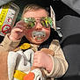 Hénèlya participe au concours pour gagner de l'argent avec cette photo : baby, sunglasses, pacifier, plush_toy, car_seat, reflection, hand, clothing, seatbelt, infant, child, toy, safety_label, person, casual, cute, indoors, portrait, accessory, comfort
