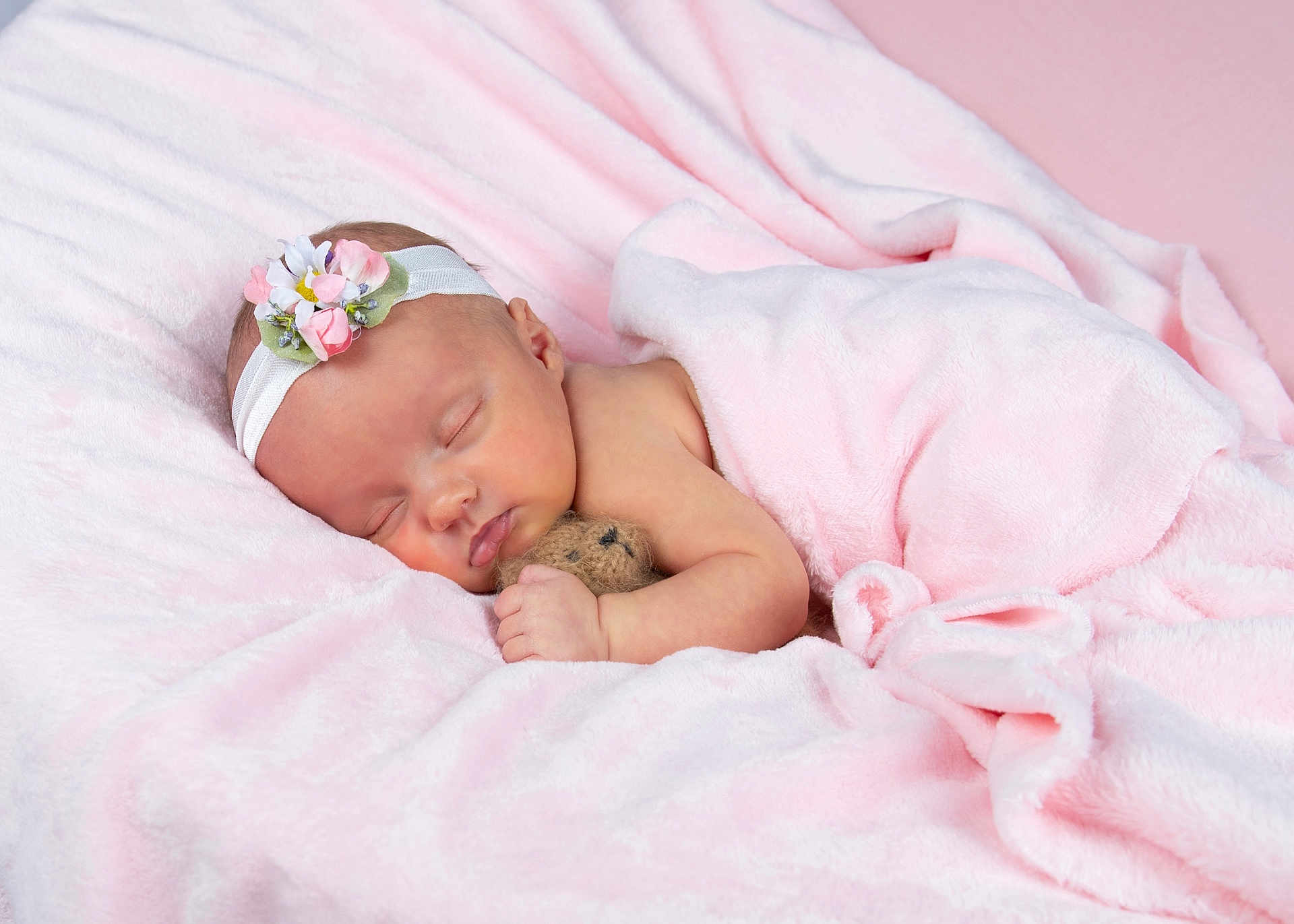 Sophia joined the competition — help win amazing prizes! baby, newborn, sleeping, blanket, pink, headband, flower, teddy_bear, soft, cute, infant, peaceful, portrait, child, rest, adorable, wrapped, cozy, skin, hand