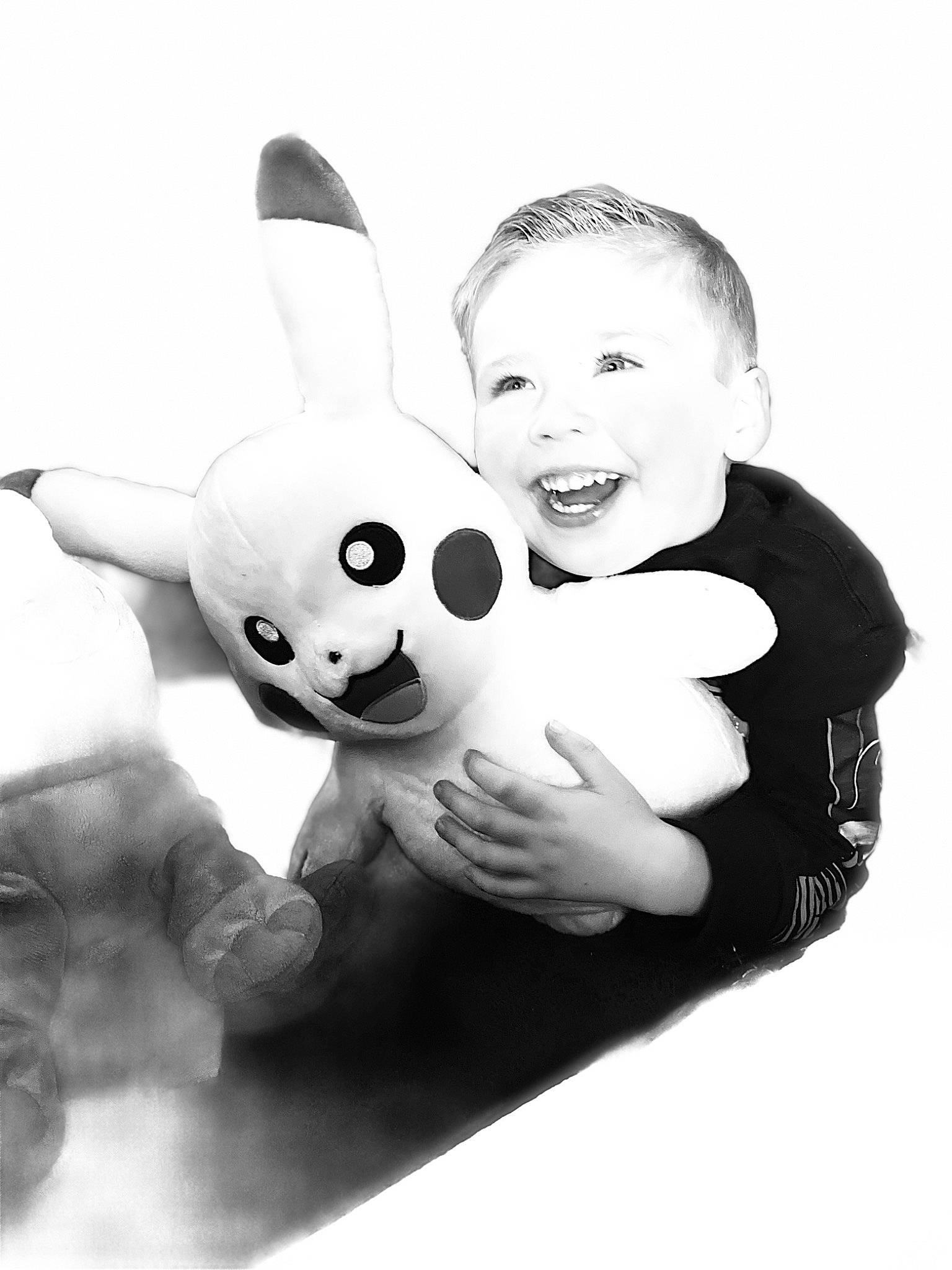 Maverick is registered to the contest to win money with this photo: arm, beauty, black_and_white, ear, eye, facial_expression, finger, flash_photography, gesture, hand, happy, human_body, mammal, monochrome, monochrome_photography, person, rabbit, smile, style, toy