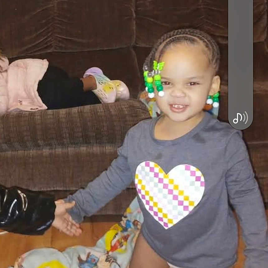 Dejanae joined the competition — help win amazing prizes! architecture, bodypart, building, child, couch, cushion, face, female, finger, furniture, girl, hand, head, homedecor, indoors, livingroom, person, photography, portrait, room