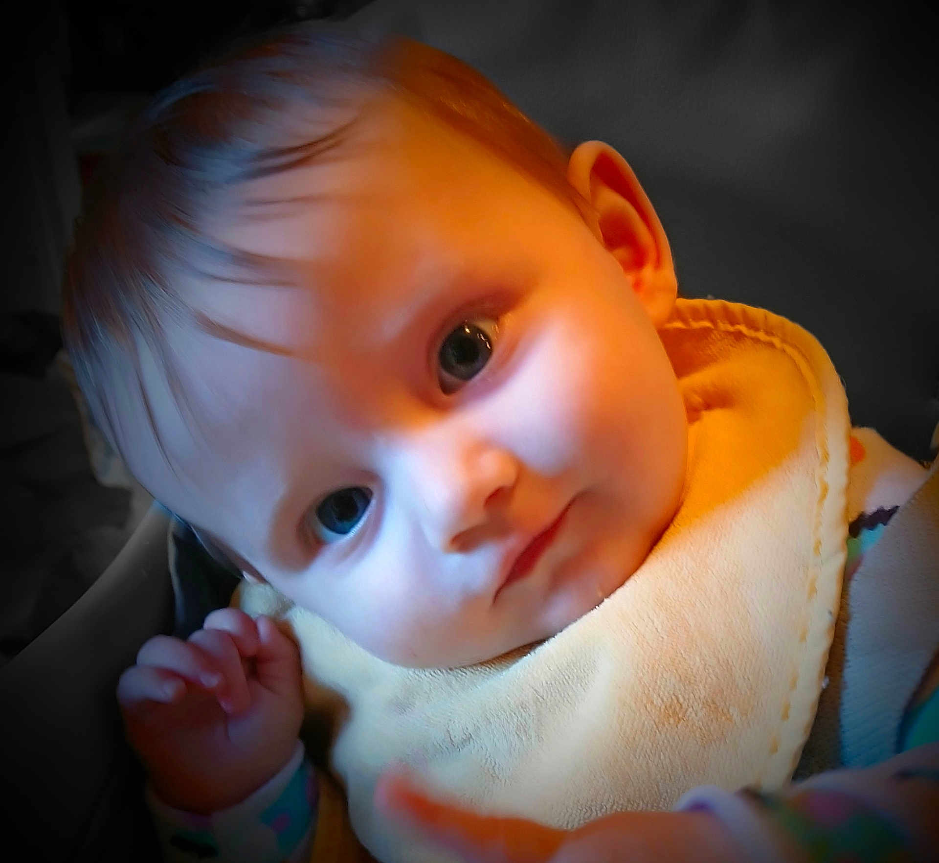Jubilee joined the competition — help win amazing prizes! baby, infant, face, eyes, bib, clothing, hand, skin, hair, portrait, closeup, child, cute, expression, young, indoor, person, soft_light, focus, background_blur