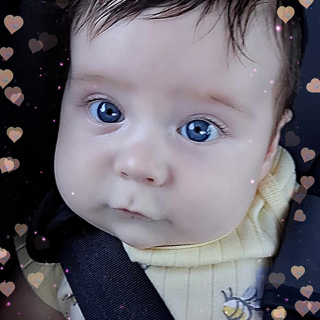 Yovani joined the competition — help win amazing prizes! adorable, baby, bee_patch, blue_eyes, car_seat, child, child_seat, closeup, clothing, cute, expression, face, heart_overlay, infant, portrait, safety_harness, seatbelt, toddler, yellow_sweater, young_child