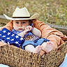 Yovani joined the competition — help win amazing prizes! baby, child, cowboy_hat, basket, flag, denim, blanket, outdoor, grass, cute, portrait, hat, footwear_free, blue_eyes, bracelet, summer, nature, infant, resting, casual