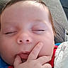 Yovani is registered to the contest to win money with this photo: baby, blanket, child, closeup, clothing, cozy, cute, face, fingers, hand, indoor, infant, peaceful, portrait, relaxing, resting, sleeping, soft, toddler, young