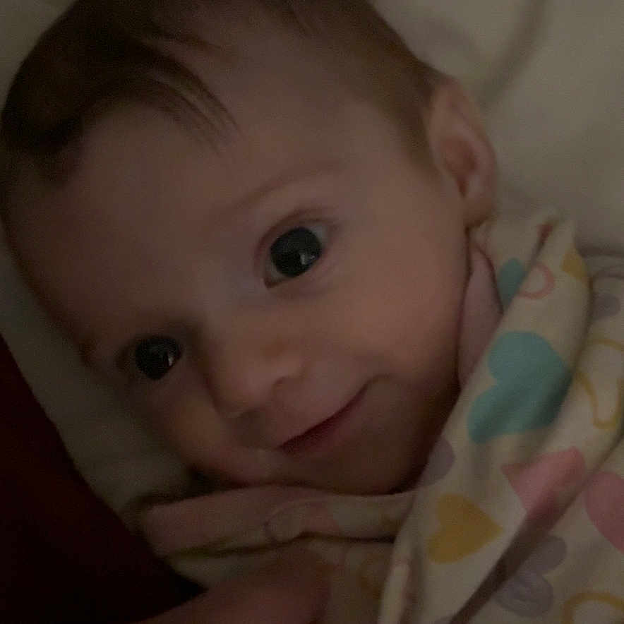 Autumn Olivia joined the competition — help win amazing prizes! baby, bed, blanket, child, close_up, cozy, cute, fabric, face, hand, heart, indoors, infant, pattern, person, smile, soft_lighting, tender, warm, wrapped