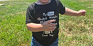 Rexton is registered to the contest to win money with this photo: child, toddler, smiling, outdoor, grass, trees, sunlight, blue_sky, shorts, tshirt, red_sandals, walking, happy, nature, park, person, summer, casual_clothing, daylight, cute