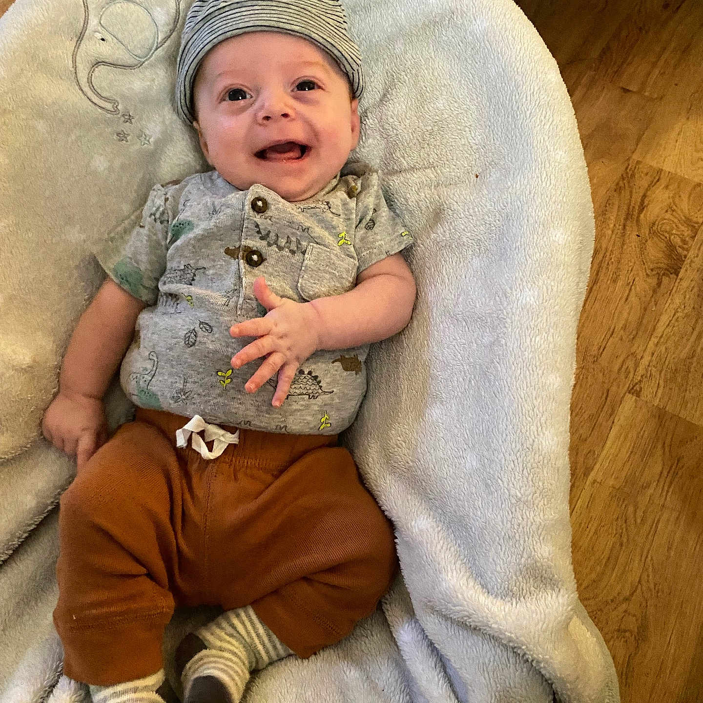 Sawyer joined the competition — help win amazing prizes! baby, blanket, bonnet, cap, clothing, couch, face, furniture, glove, hat, head, homedecor, hosiery, newborn, pants, person, photography, portrait, sitting, sock