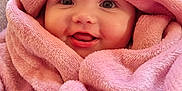 Elsie joined the competition — help win amazing prizes! baby, blanket, pink, cozy, smile, face, child, wrapped, soft, cute, infant, expression, warm, indoors, portrait, happy, adorable, cuddly, plush, toddler