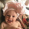 Dallas Morgan joined the competition — help win amazing prizes! baby, blanket, child, clothing, couch, cozy, cute, happy, headwear, indoor, infant, light, person, pink, portrait, relaxing, skin, smiling, soft, window