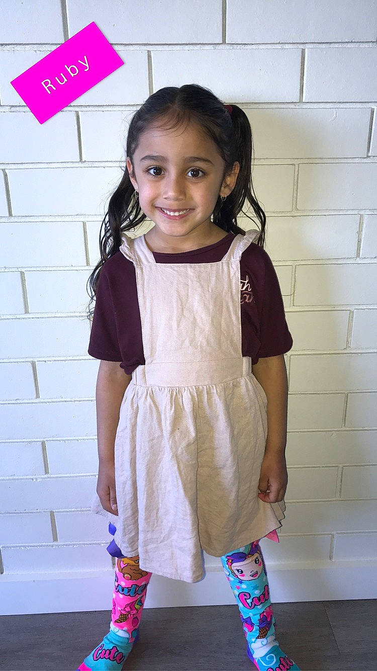 Ruby joined the competition — help win amazing prizes! baby_toddler_clothing, clothing, day_dress, dress, face, fashion_design, hair, happy, head, joint, joy, neck, one_piece_garment, organ, person, pink, red, sleeve, smile, street_fashion