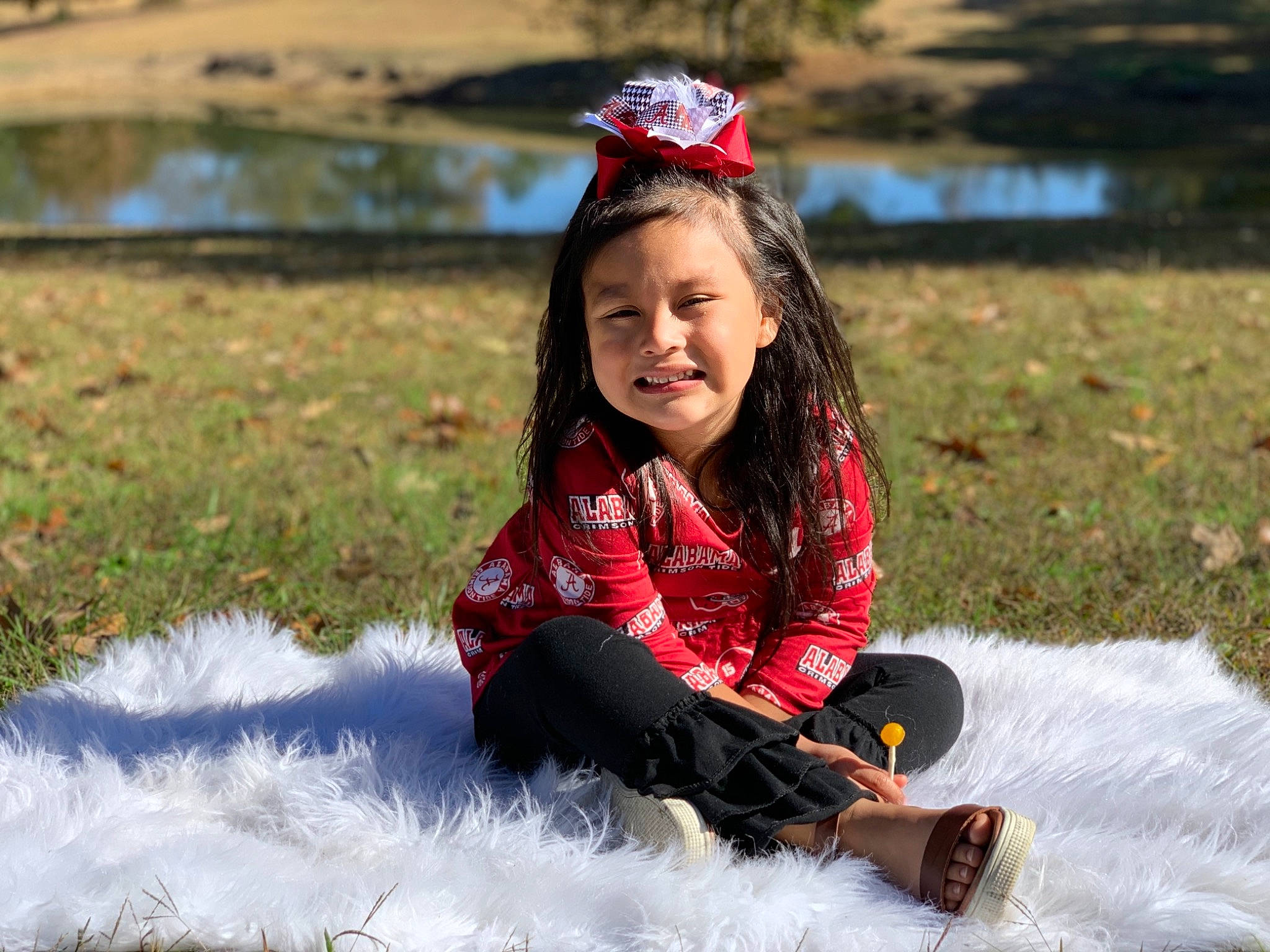 Marissa is registered to the contest to win money with this photo: child, child_model, fun, grass, happy, joy, leisure, person, play, recreation, sitting, smile, toddler, vacation, water