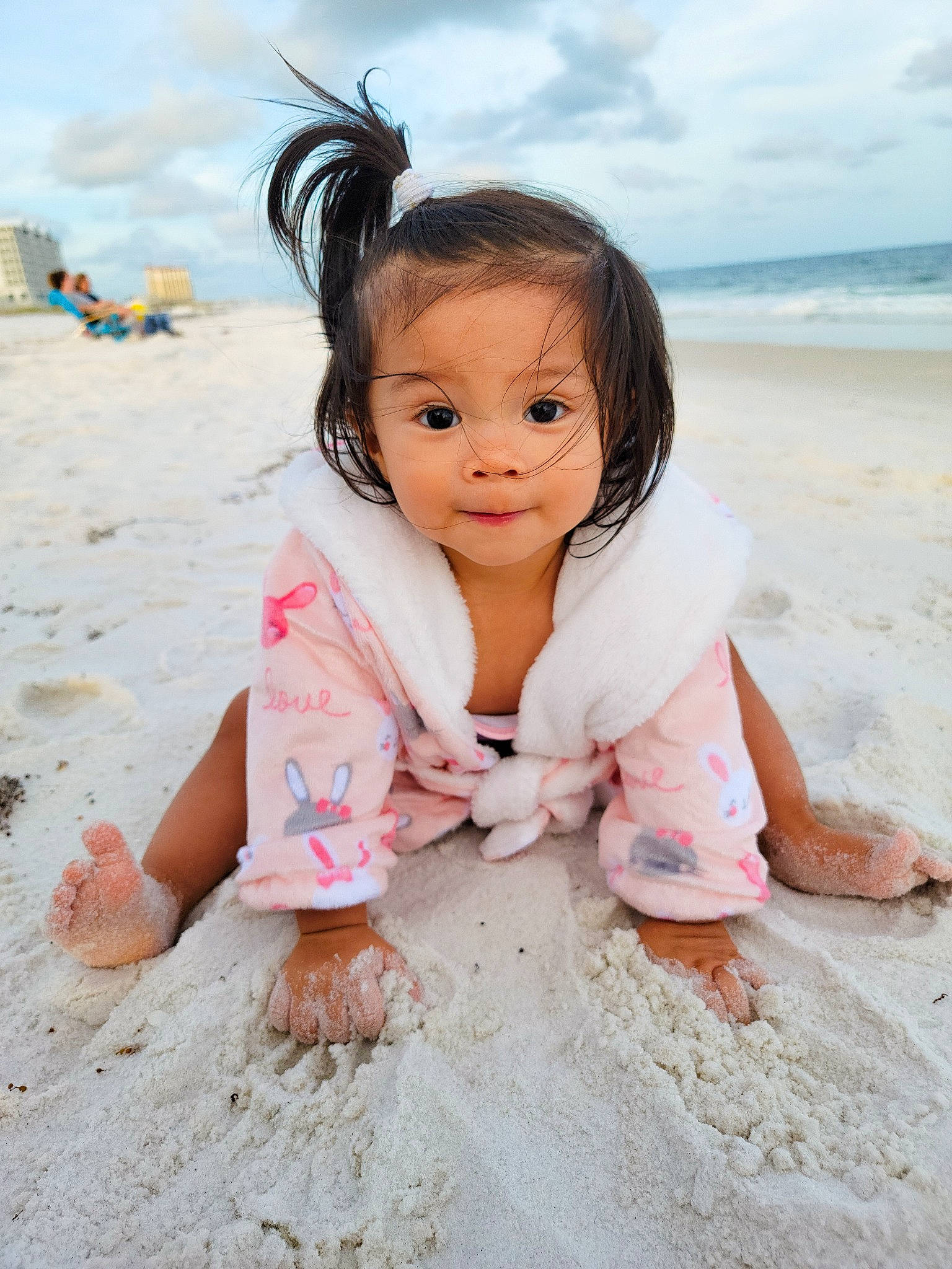 Lana is registered to the contest to win money with this photo: beach, body_of_water, child, cloud, coast, flash_photography, foot, fun, grass, happy, leisure, ocean, people_in_nature, people_on_beach, person, sand, sitting, sky, summer, toddler