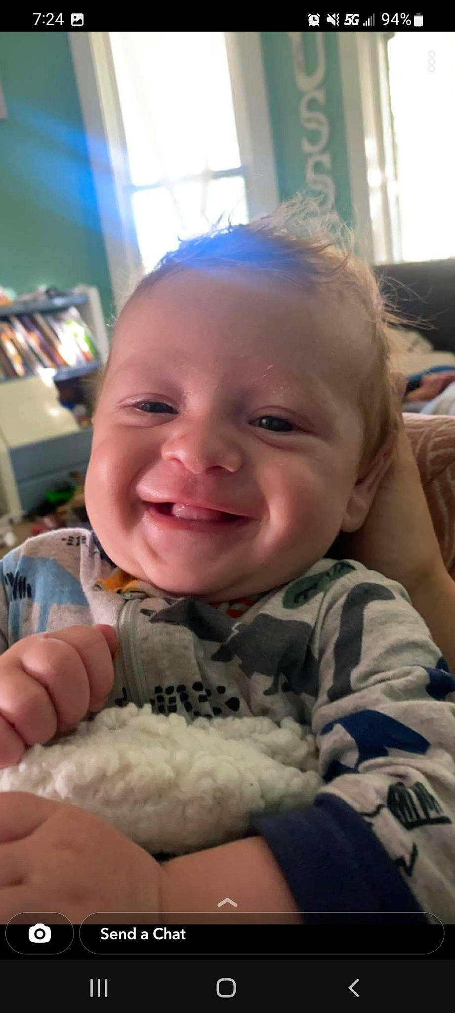 Jensen is registered to the contest to win money with this photo: baby, baby_toddler_clothing, cheek, chin, eyebrow, facial_expression, finger, gesture, happy, head, human, iris, joy, lip, mouth, nose, organ, person, skin, smile