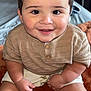 Arsenio joined the competition — help win amazing prizes! baby, child, smiling, sitting, knit_sweater, shorts, blanket, indoors, cute, happy, face, arms, legs, skin, hair, buttoned_shirt, infant, portrait, warm_colors, cozy