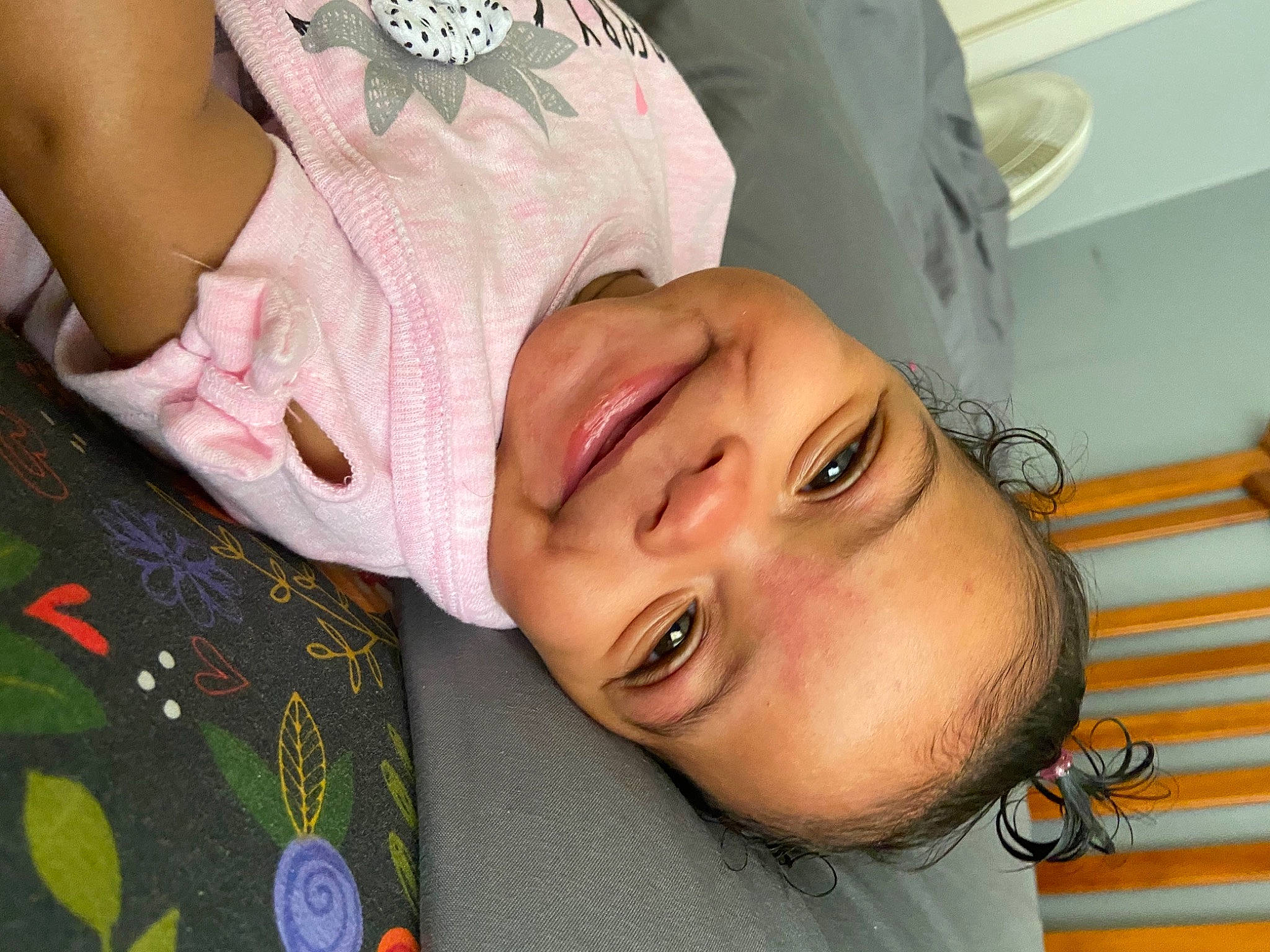 Samira is registered to the contest to win money with this photo: baby_toddler_clothing, cheek, child, comfort, event, eyebrow, eyelash, gesture, happy, joy, lip, mouth, neck, nose, pattern, person, skin, sleeve, smile, throat