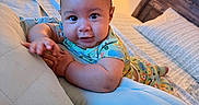 Kyson joined the competition — help win amazing prizes! baby, child, pajamas, bed, pillow, lamp, bedroom, furniture, sleepwear, infant, person, indoors, cute, smiling, lying_down, cozy, soft_lighting, head, expression, home