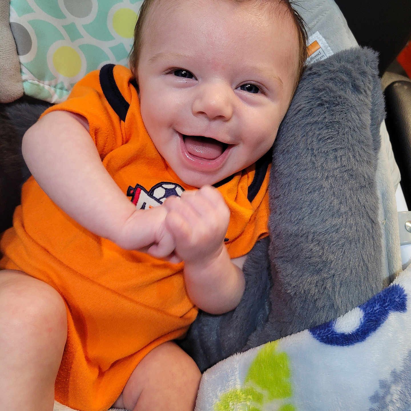 Aidyn joined the competition — help win amazing prizes! baby, babylaughing, blanket, bodypart, car, car_interior, couch, cushion, face, finger, furniture, hand, happy, head, homedecor, laughing, person, photography, portrait, smile