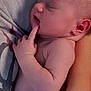 adult_hand, baby, closeup, cradling, cute, fingers, hand, human, infant, nail_polish, newborn, peaceful, person, portrait, red_nails, rest, skin, sleeping, soft_light, tender