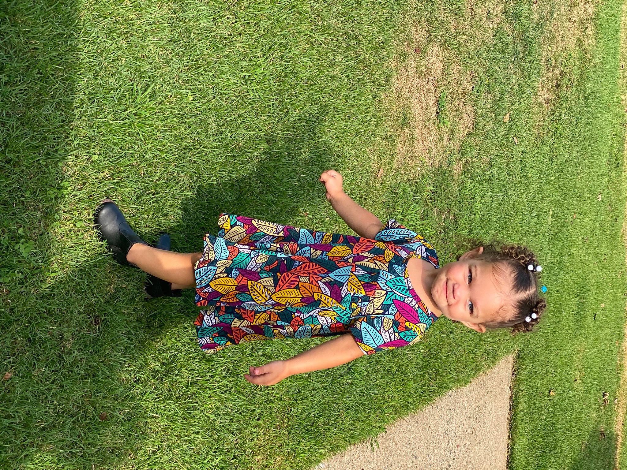 Kyrah is registered to the contest to win money with this photo: dress, grass, grass_family, grassland, groundcover, happy, human_leg, joy, lawn, leg, leisure, meadow, natural_environment, pattern, people_in_nature, person, plant, recreation, shrub, t_shirt