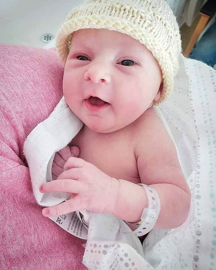 Bradley is registered to the contest to win money with this photo: beauty, cheek, child, girl, hair_accessory, hand, headgear, infant, lip, nose, person, pink, product, skin, smile, textile, toddler